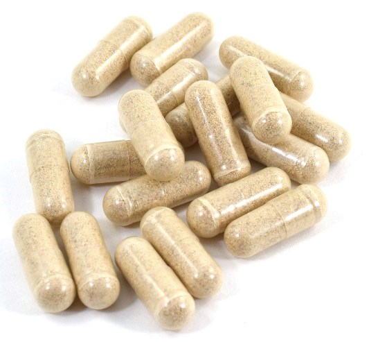 MDMA capsules on white background