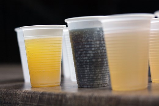 Plastic cups full of drink