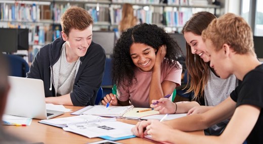 Group of teenagers studying